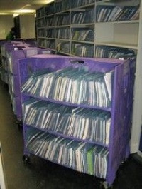 Moving library transfer trolley